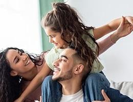 Mom, and daughter, on dad's shoulders